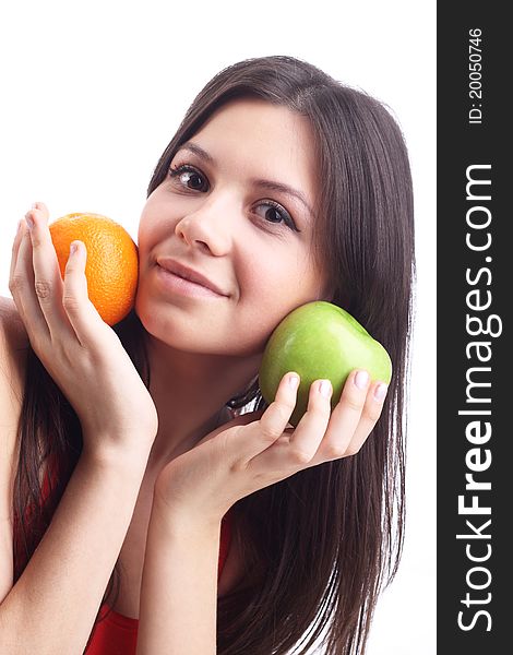 Young woman with  apple and orange. Isolated