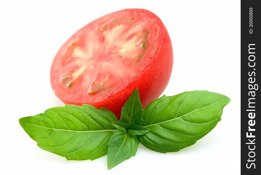 Sweet and juice tomatoes and basil close up