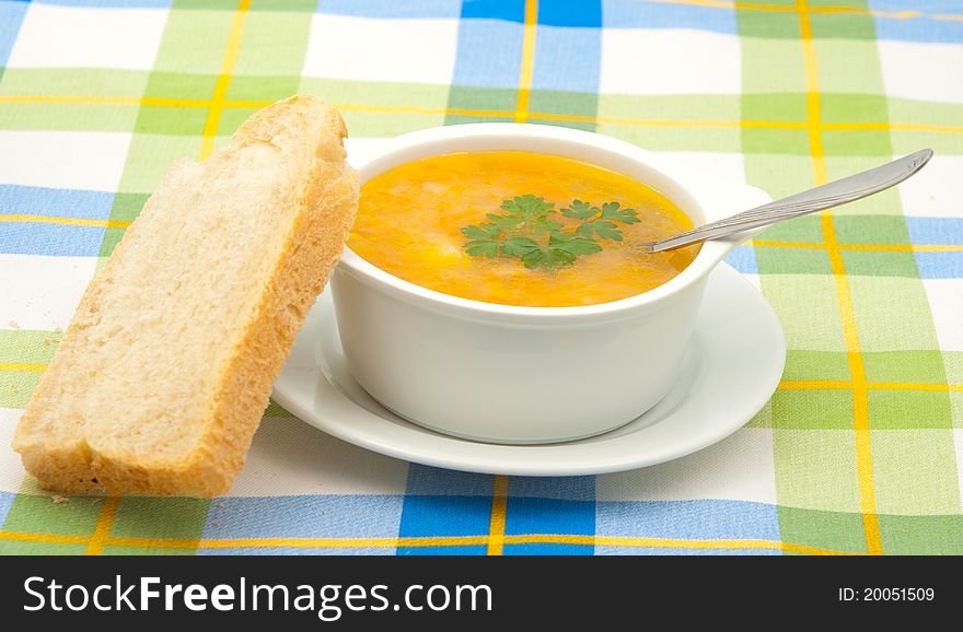 Soup on a checkered tablecloth
