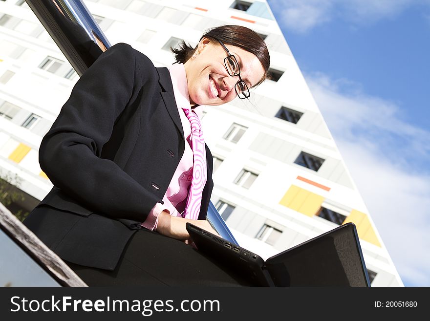 Pretty young woman manager in a neck tie outdoor shot