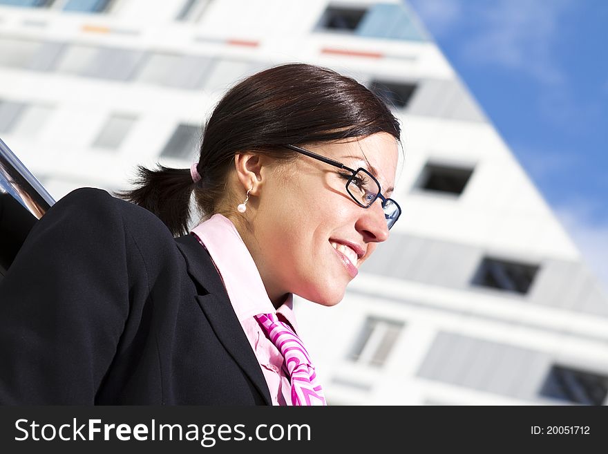 Pretty young woman manager in a neck tie outdoor shot