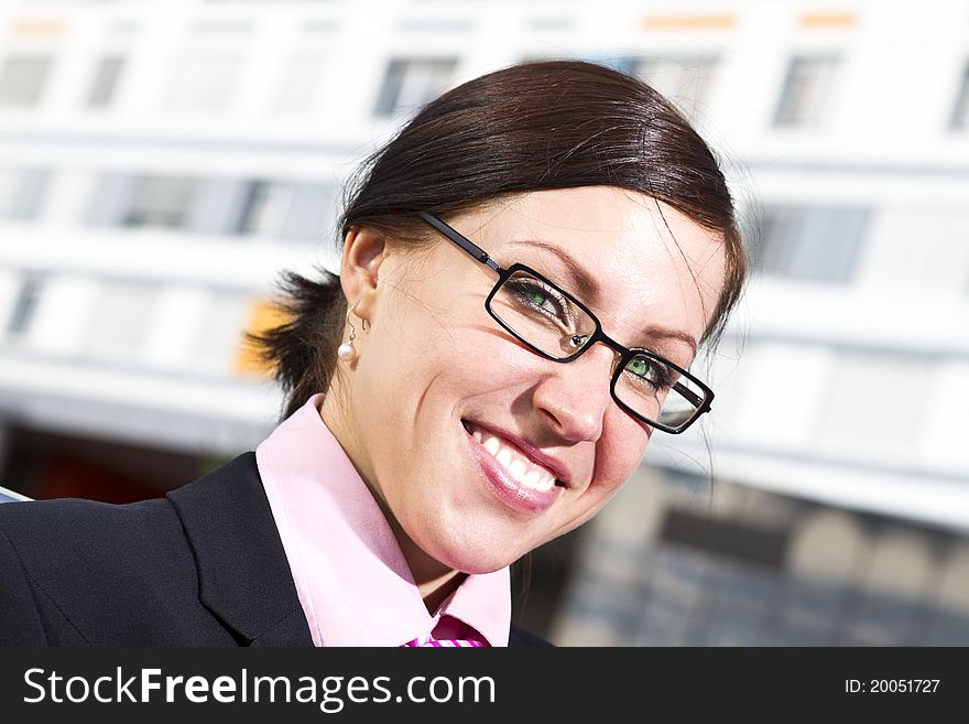 Pretty young woman manager in a neck tie outdoor shot