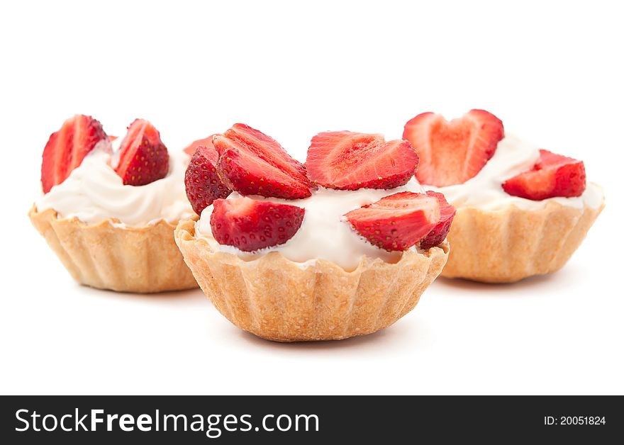 Strawberries and cream in a basket on a white background