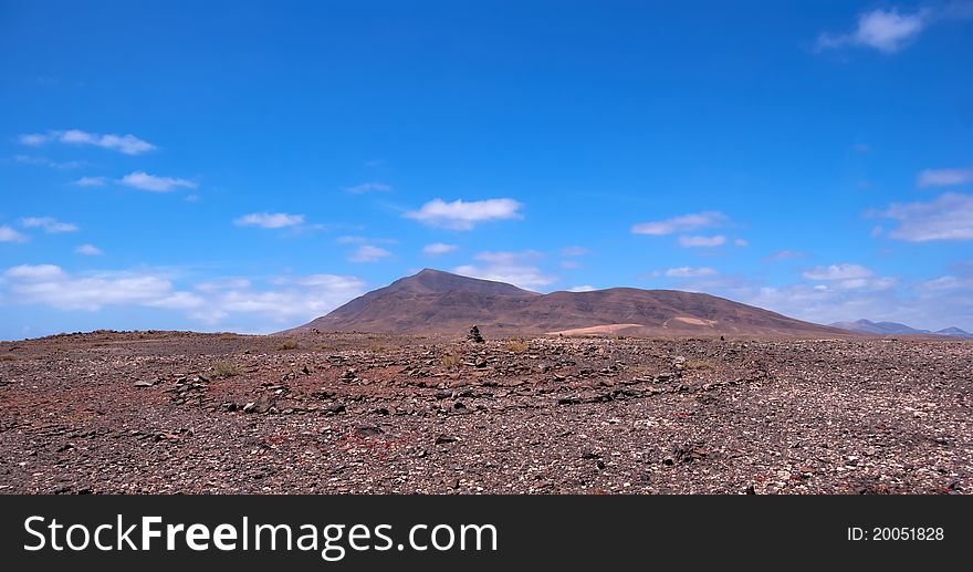 Rock pile and stone circile in lanzarote with mountain background. Rock pile and stone circile in lanzarote with mountain background