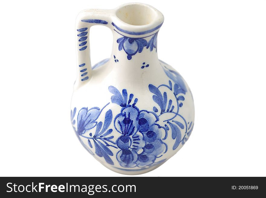 Chinese style jar painted in blue leaves and flowers. Chinese style jar painted in blue leaves and flowers