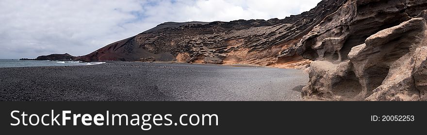 Panoramic view of charco de los clicos, black beach in el golfo, lanzarote, canary islands