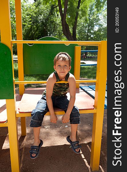 Cute Young Boy On Playground