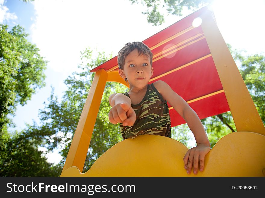 Cute young boy playing on playground. Cute young boy playing on playground
