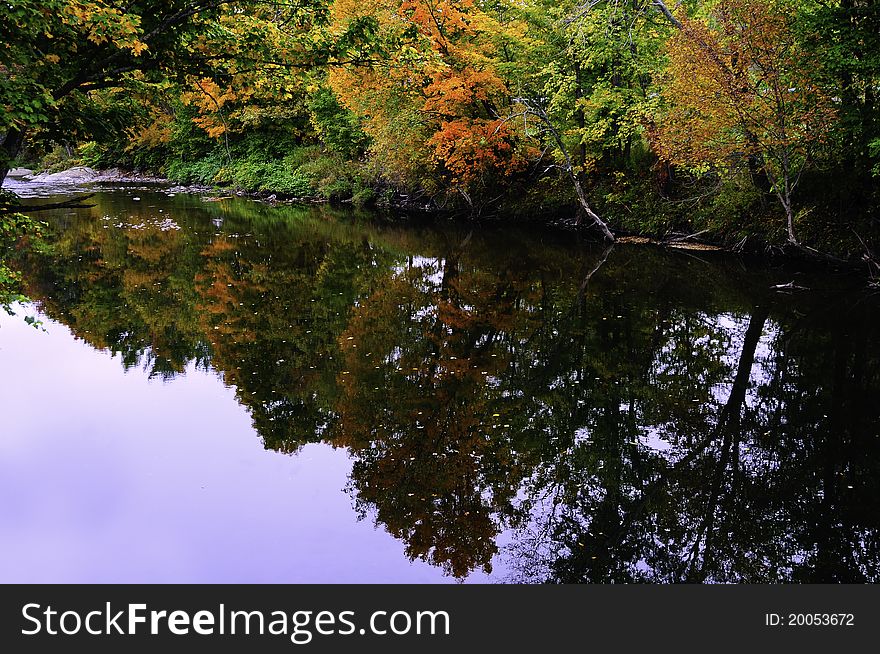 Beautiful fall colors reflected in a still creek. Beautiful fall colors reflected in a still creek
