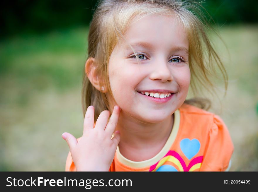 Cute little girl  on the meadow