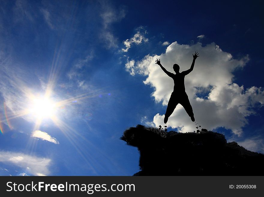 Silhouette man jumping on the mountain