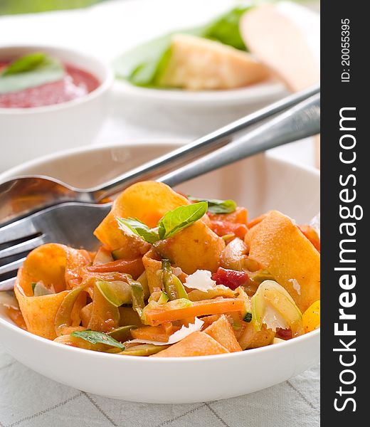 Tagliatelle pasta with tomato and vegetable sauce