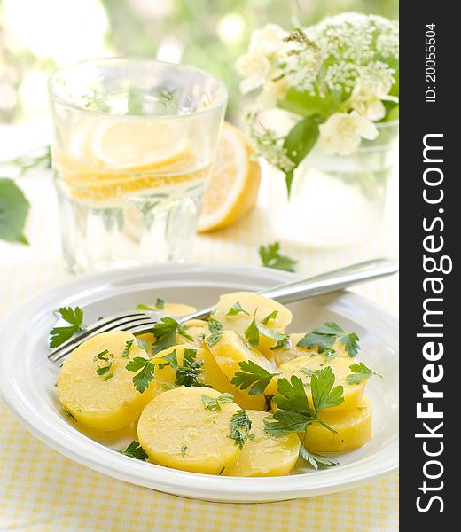 Potato salad with parsley and olive oil. Selective focus