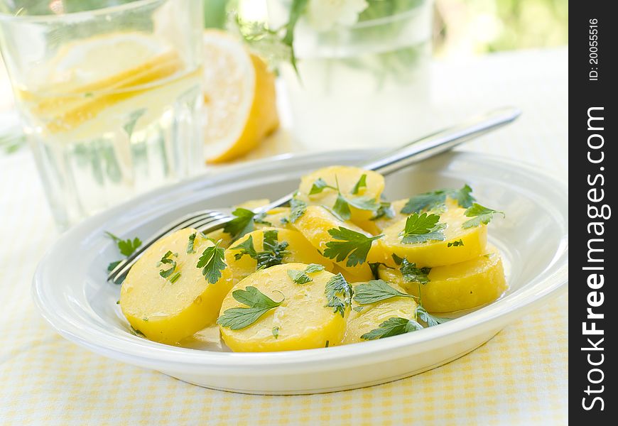 Potato salad with parsley and olive oil. Selective focus