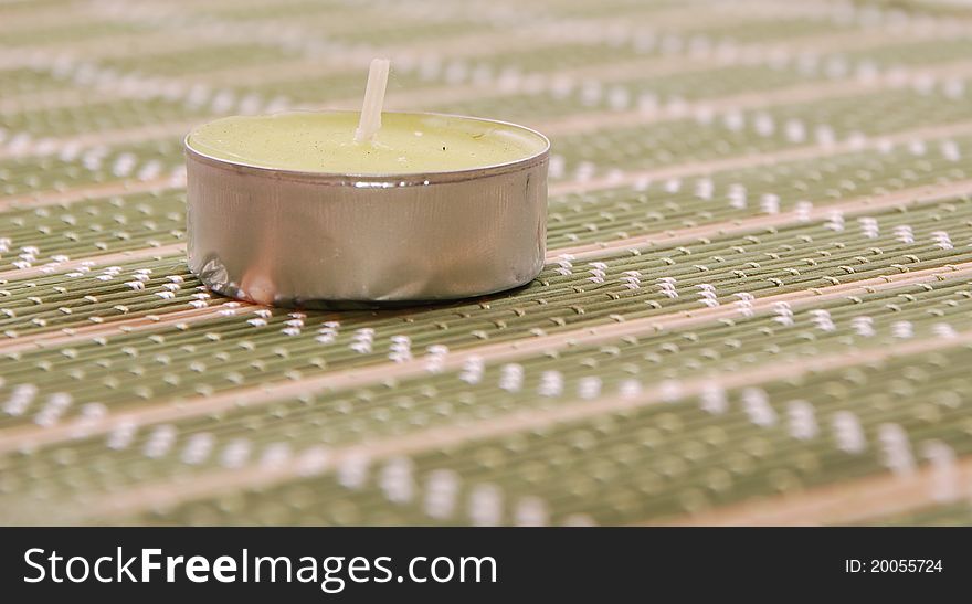 Candle on a tablemat green