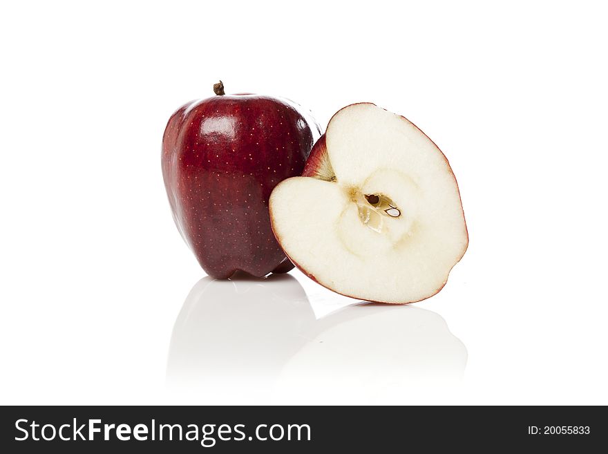 A fresh red apple with a slice cut out