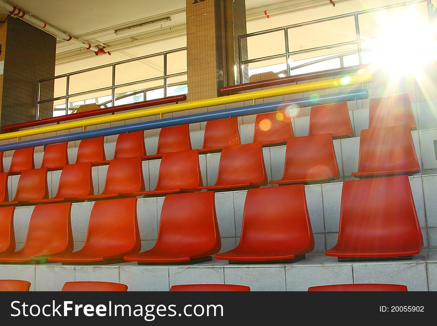 Stadium chairs under sunlight