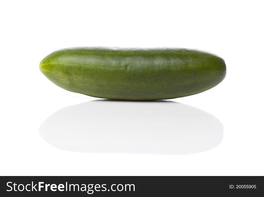 A fresh green cucumber on a white background