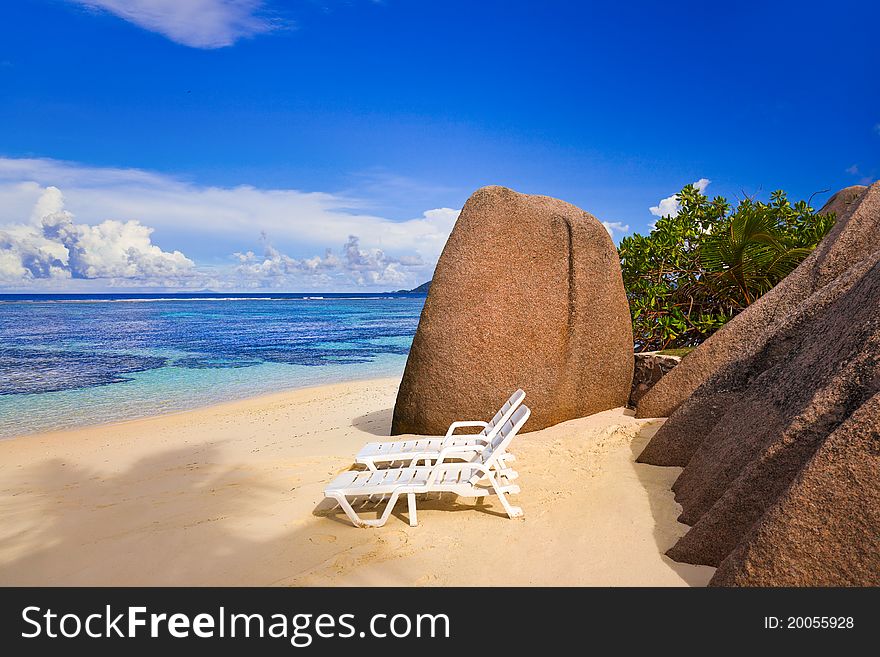 Chairs on tropical beach at Seychelles - vacation background