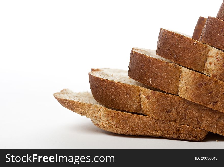 Slices of wheat bread against a white background