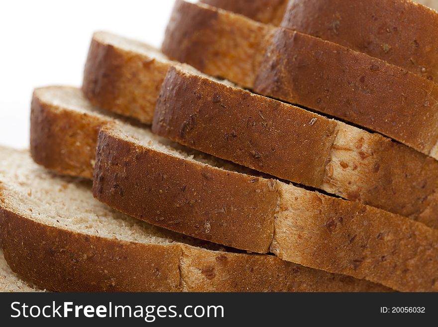 Slices of wheat bread against a white background