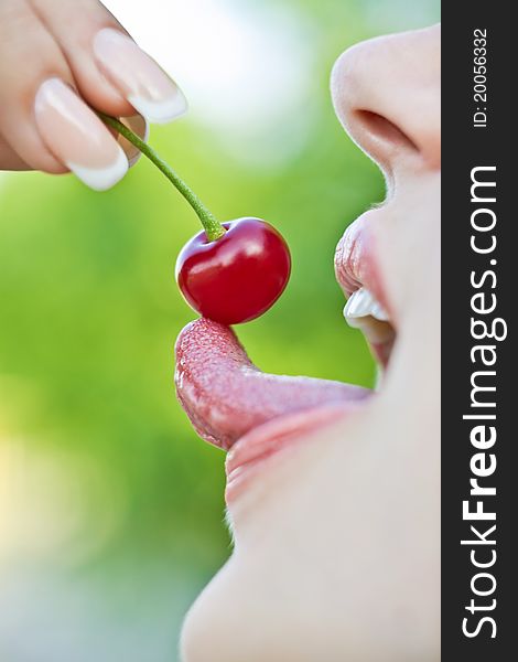 Portrait of mouth eating cherry. Portrait of mouth eating cherry