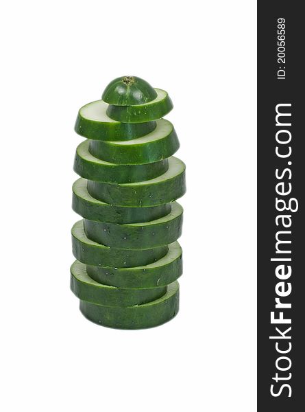 Sliced cucumber stacked vertical isolated white background