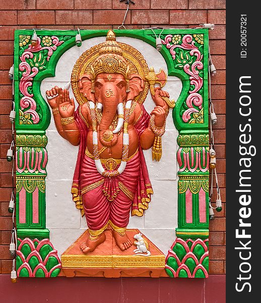 Ganesh concrete carving in standing action on the wall. Ganesh concrete carving in standing action on the wall