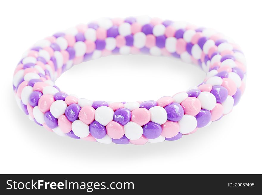 Plastic bracelet in the lilac tones on the white