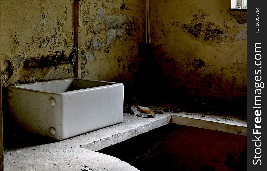 A photo of an old sink. A photo of an old sink