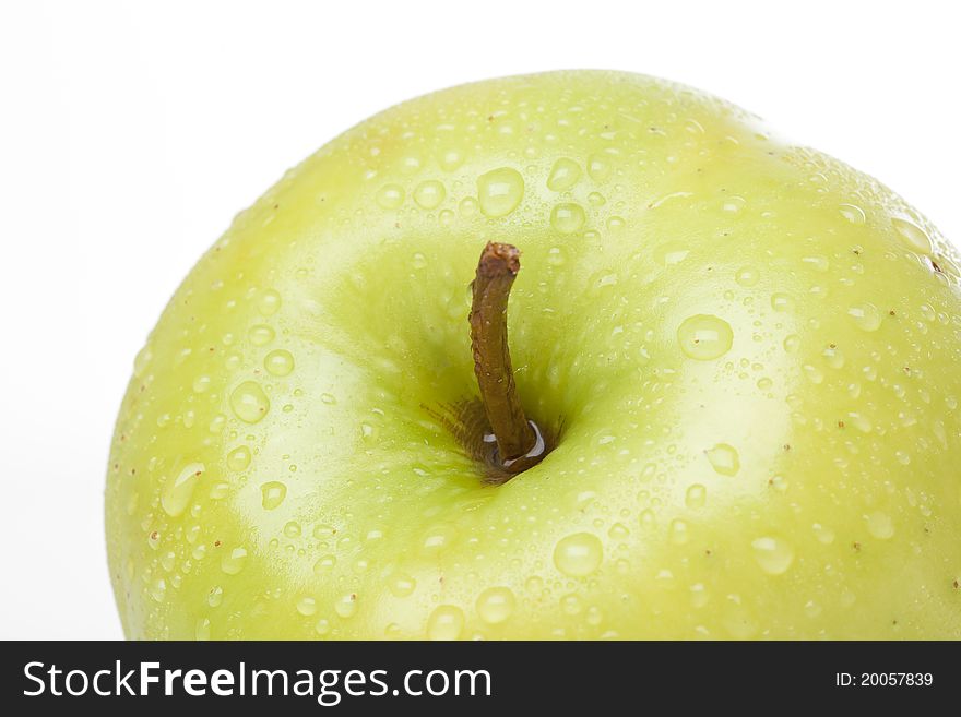 A fresh golden delicious apple close up. A fresh golden delicious apple close up