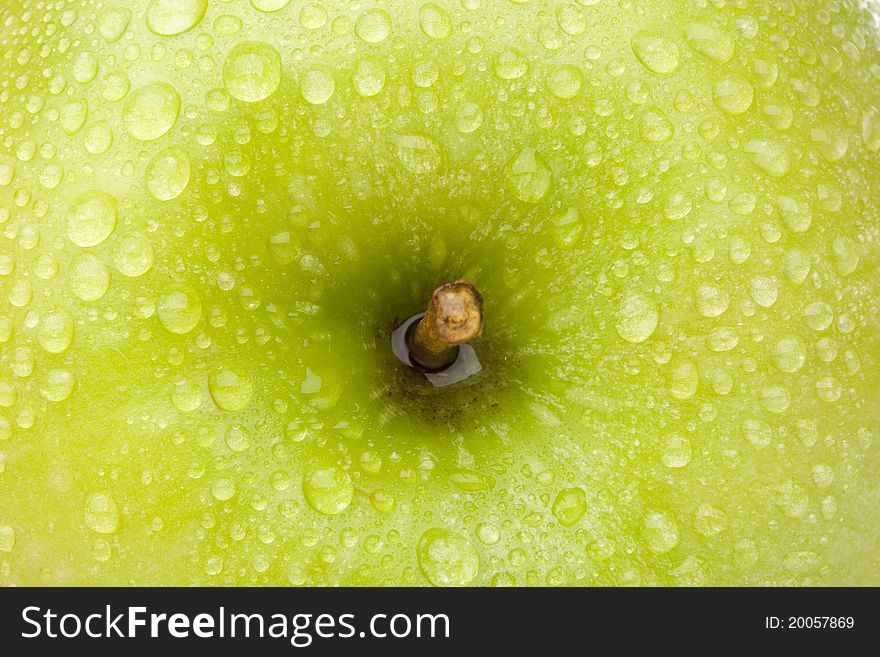 A fresh granny smith apple close up. A fresh granny smith apple close up