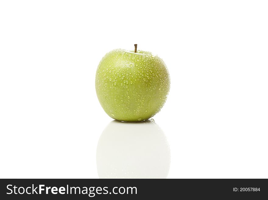 A granny smith apple against a white background