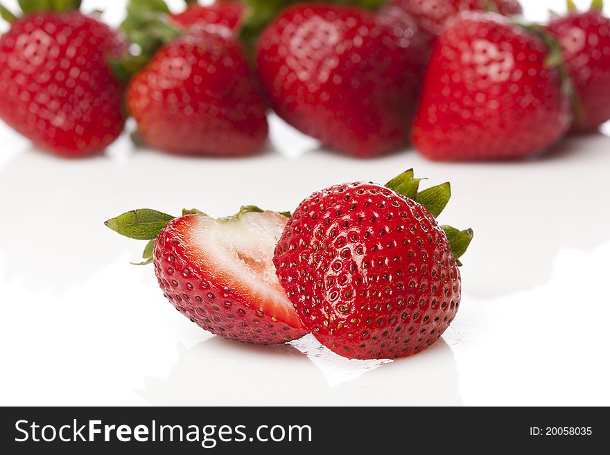 Fresh red strawberries against a white background