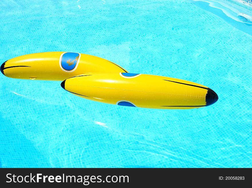 Yellow banana in swimming pool.