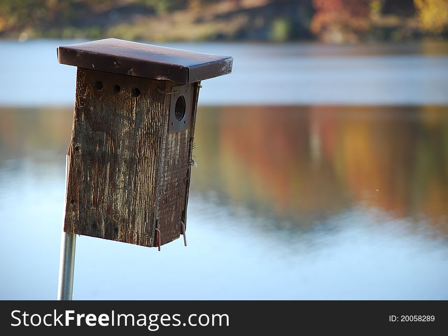 Birdhouse at the lake in fall