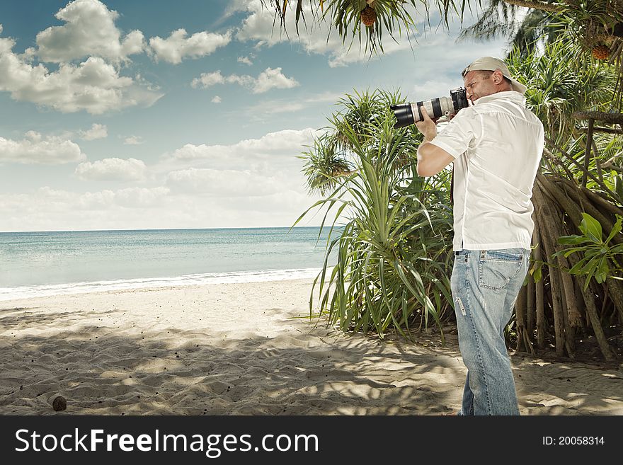 Portrait of photographer taking picture in tropical environment. Portrait of photographer taking picture in tropical environment