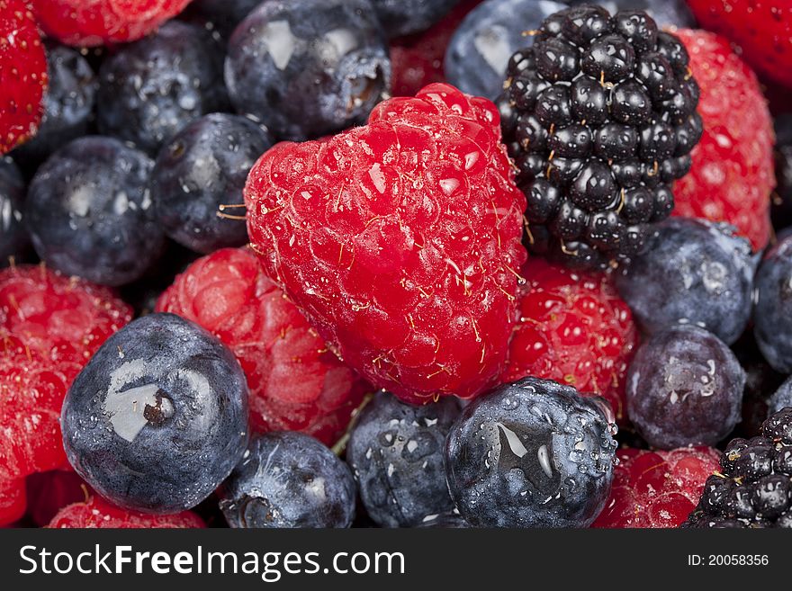A group of berries in a bowl. A group of berries in a bowl