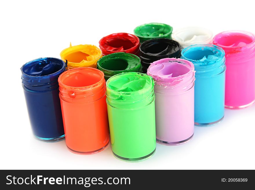 Colorful paints bottles isolated on white background.