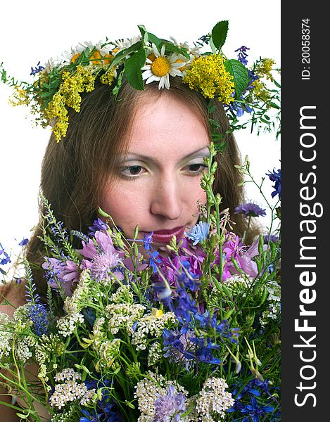 Beautiful young women with floral wreath on white background. Shallow DOF, focus on bouquet