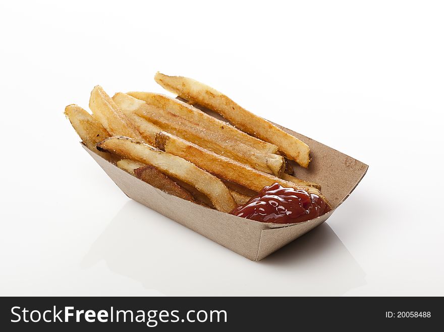 A group of hot french fries against a white background