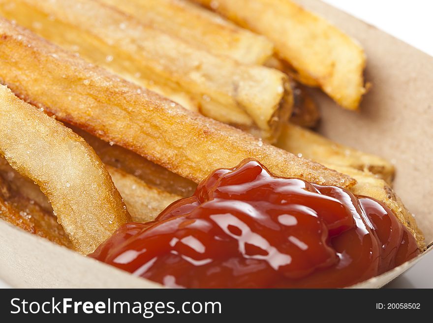 A group of hot french fries against a white background