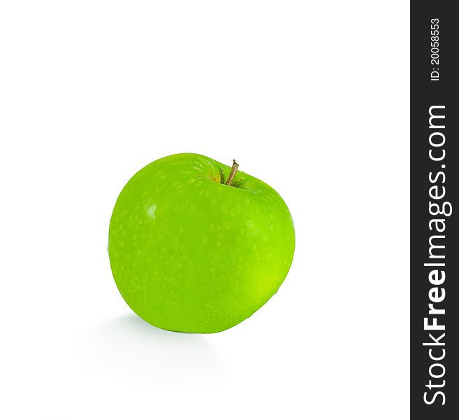 Isolated green apple with drops of water