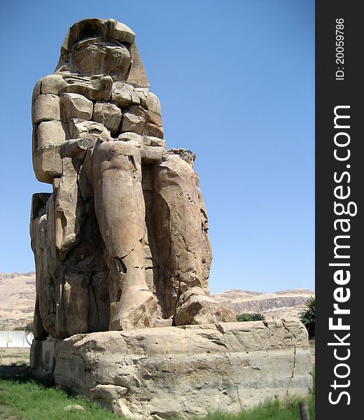 Coloss of Memnon are two massive statues of Pharaoh Amenhotep III that stands in the Theban necropolis.