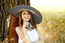 Girl Sitting Near Tree With Vintage Camera. Royalty Free Stock Image Girl Sitting Near Tree With Vintage Camera. Royalty Free Stock Image