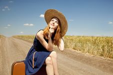 Girl With Suitcase At Country Road. Stock Images Girl With Suitcase At Country Road. Stock Images