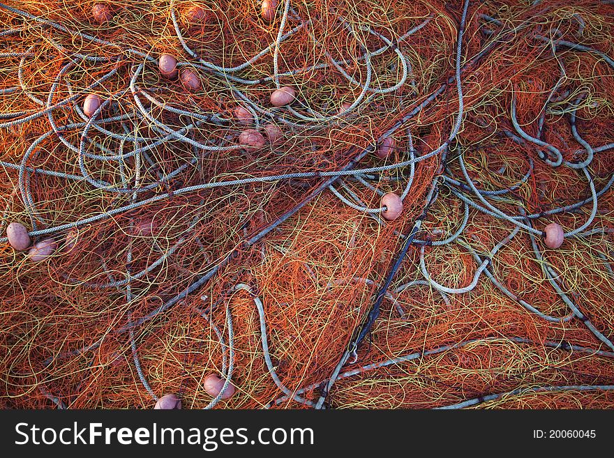 Pile orange fishing net background texture pattern.