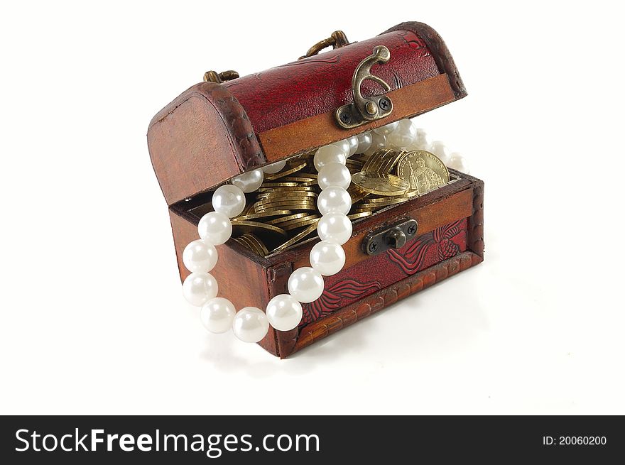 Chest with coins and large pearls isolated on white background