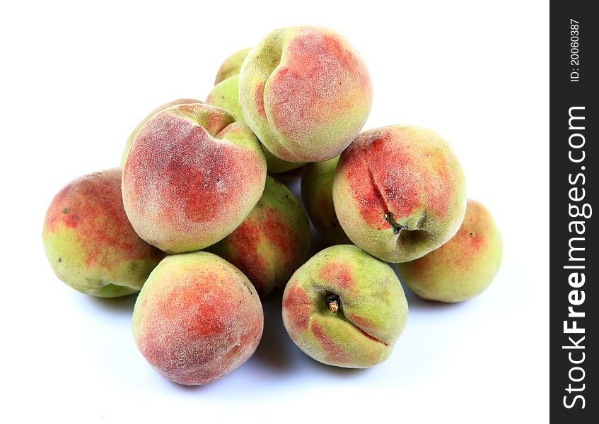 Ripe apricots over white background.