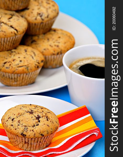 Chocolate chip muffins and cup of fresh coffee. Chocolate chip muffins and cup of fresh coffee